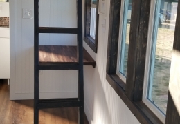 Dark stained ladder in the Lincoln Peak to math interior trim