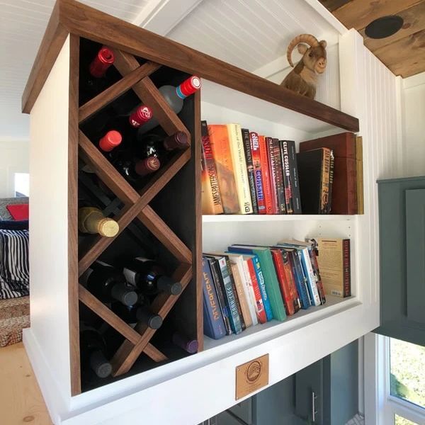 Storage with style! Here's an example of a loft privacy/ storage wall we offer to help add a little extra storage space in your Tiny Mountain House!